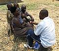 Zambian farmer Peter Malata and his family being interviewed about climate change