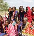 Community discussing solutions to a changing climate and water flows in Olbil, Tanzania